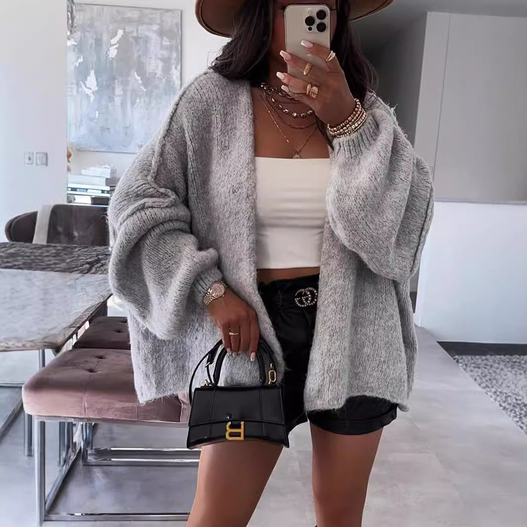 Loose solid color medium length knitted sweater cardigan jacket